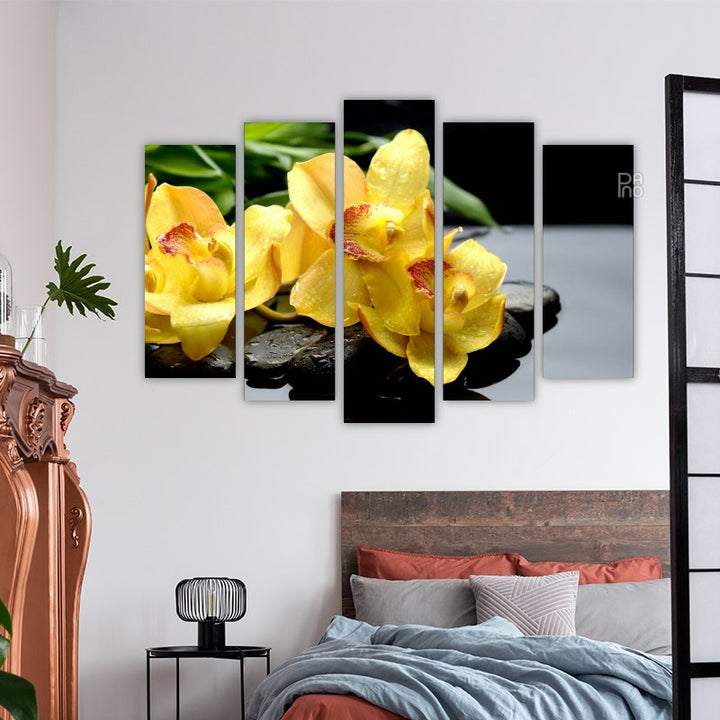 Yellow flowers on zen stones