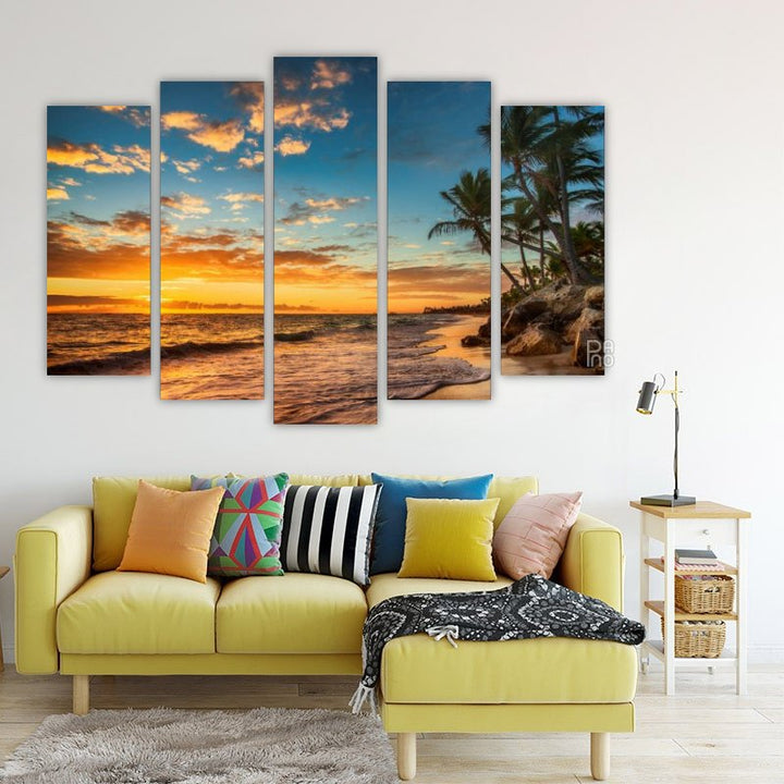 Island with palm trees at sunset
