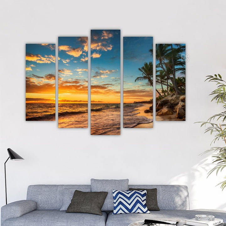 Island with palm trees at sunset
