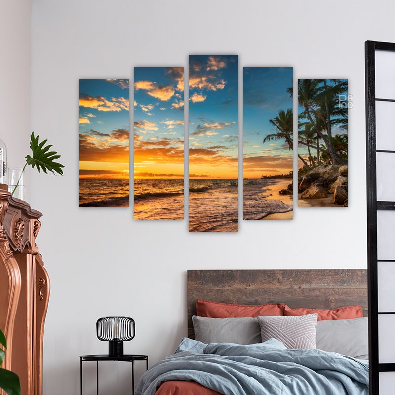 Island with palm trees at sunset