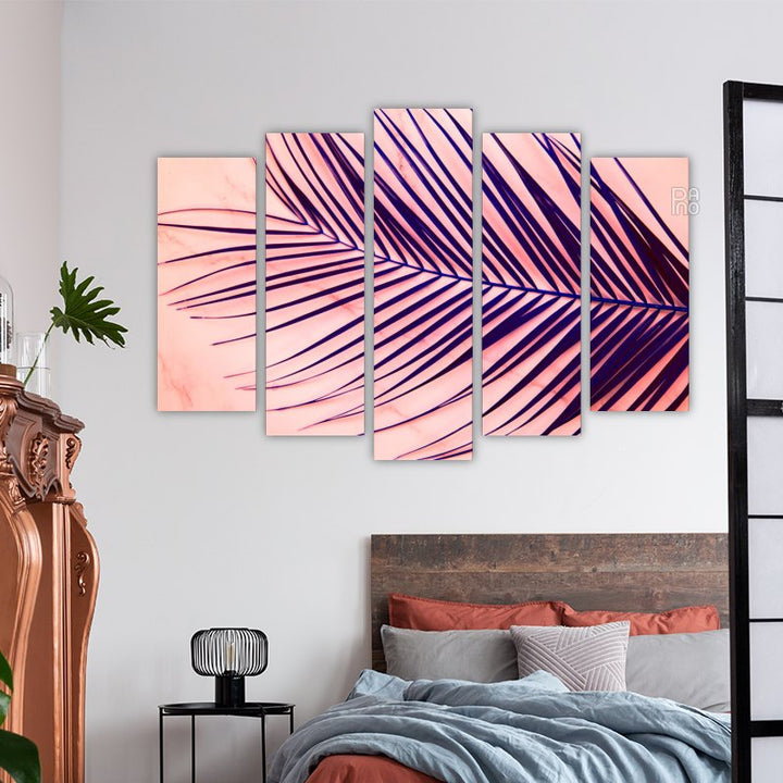 Palm leaves on a pink background