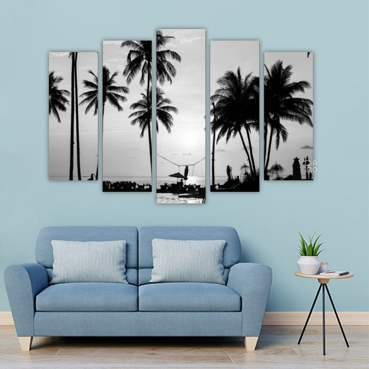 Silhouettes of palm trees on a tropical beach