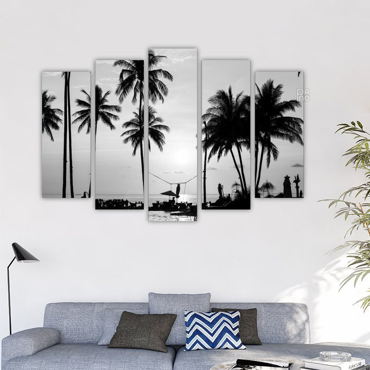 Silhouettes of palm trees on a tropical beach