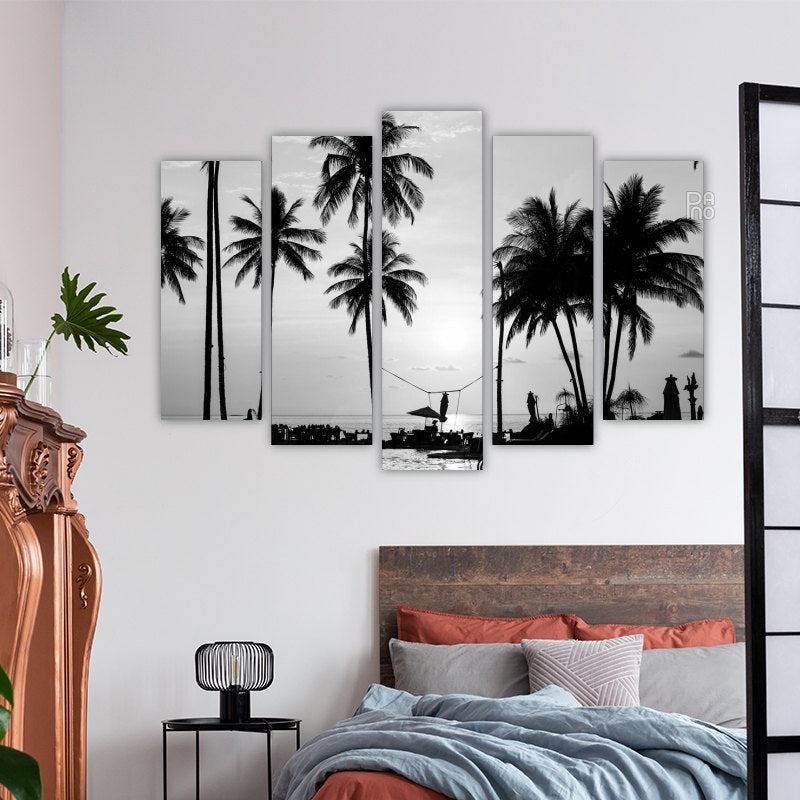 Silhouettes of palm trees on a tropical beach