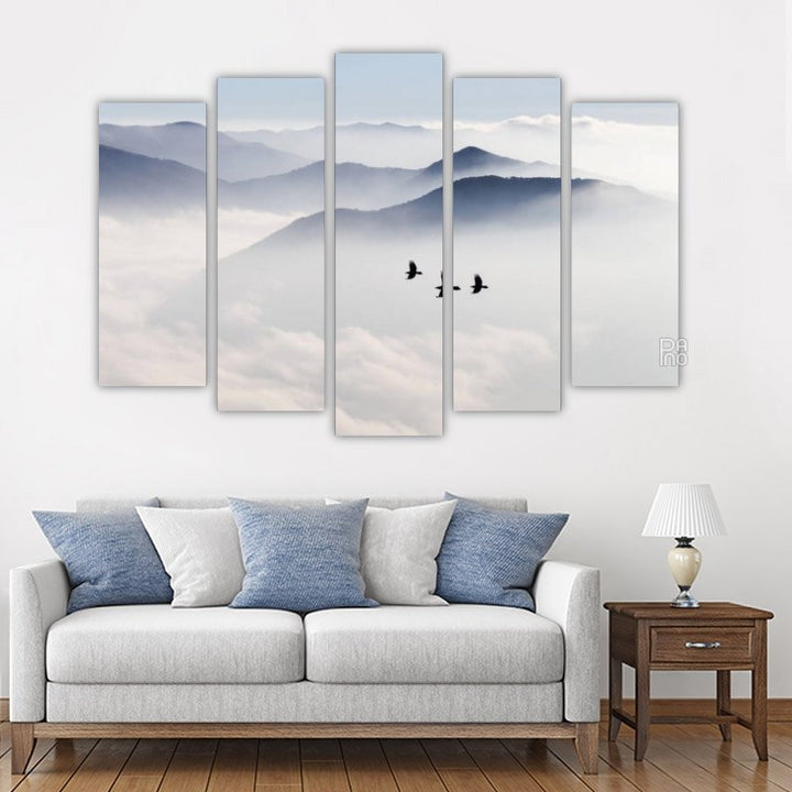 Silhouettes of mountains and birds