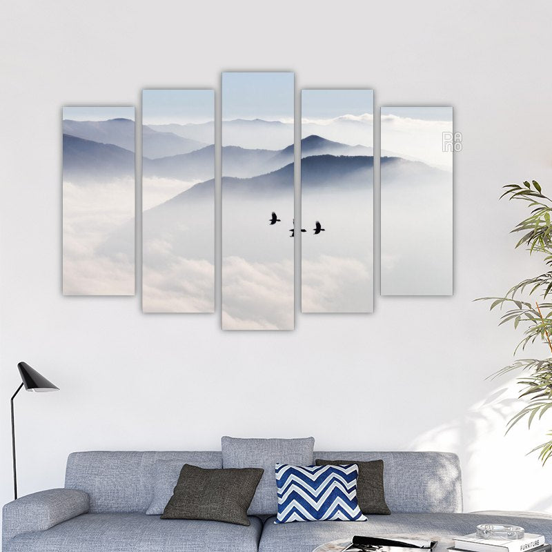 Silhouettes of mountains and birds